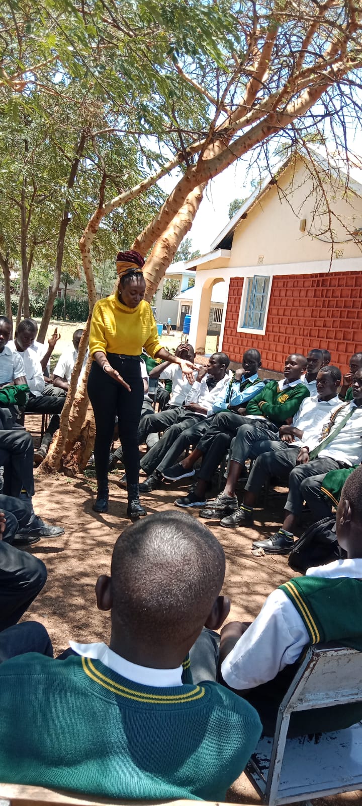 Young girl smiling and holding educational materials